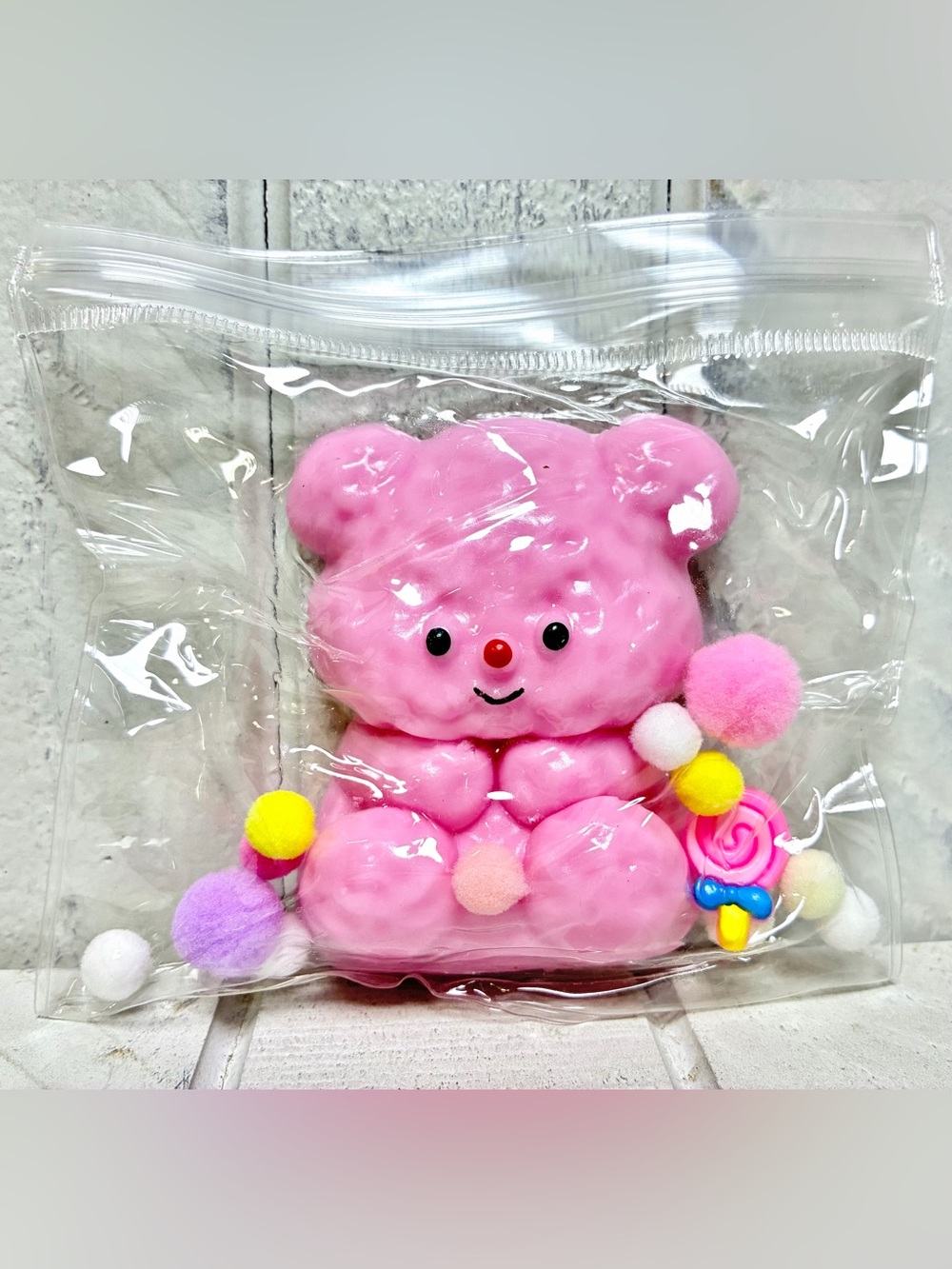 Squishy Toy Cute Pink Teddy Bear With Colorful Pom Poms In Clear Resealable Bag